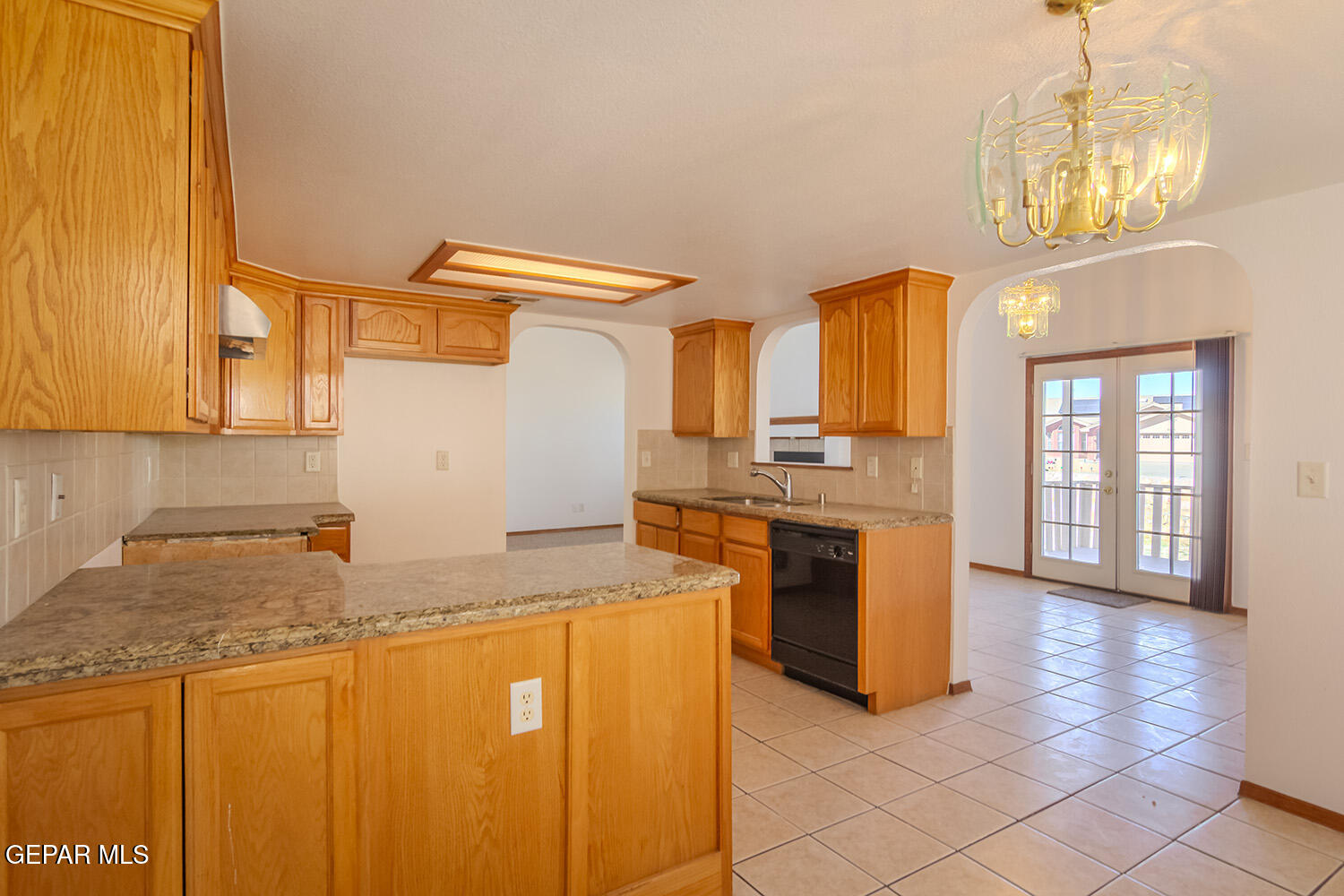 12259 Tierra Loma Road El Paso, TX 79938 - Photo 67 of 73 a kitchen with stainless steel appliances granite countertop a sink and cabinets