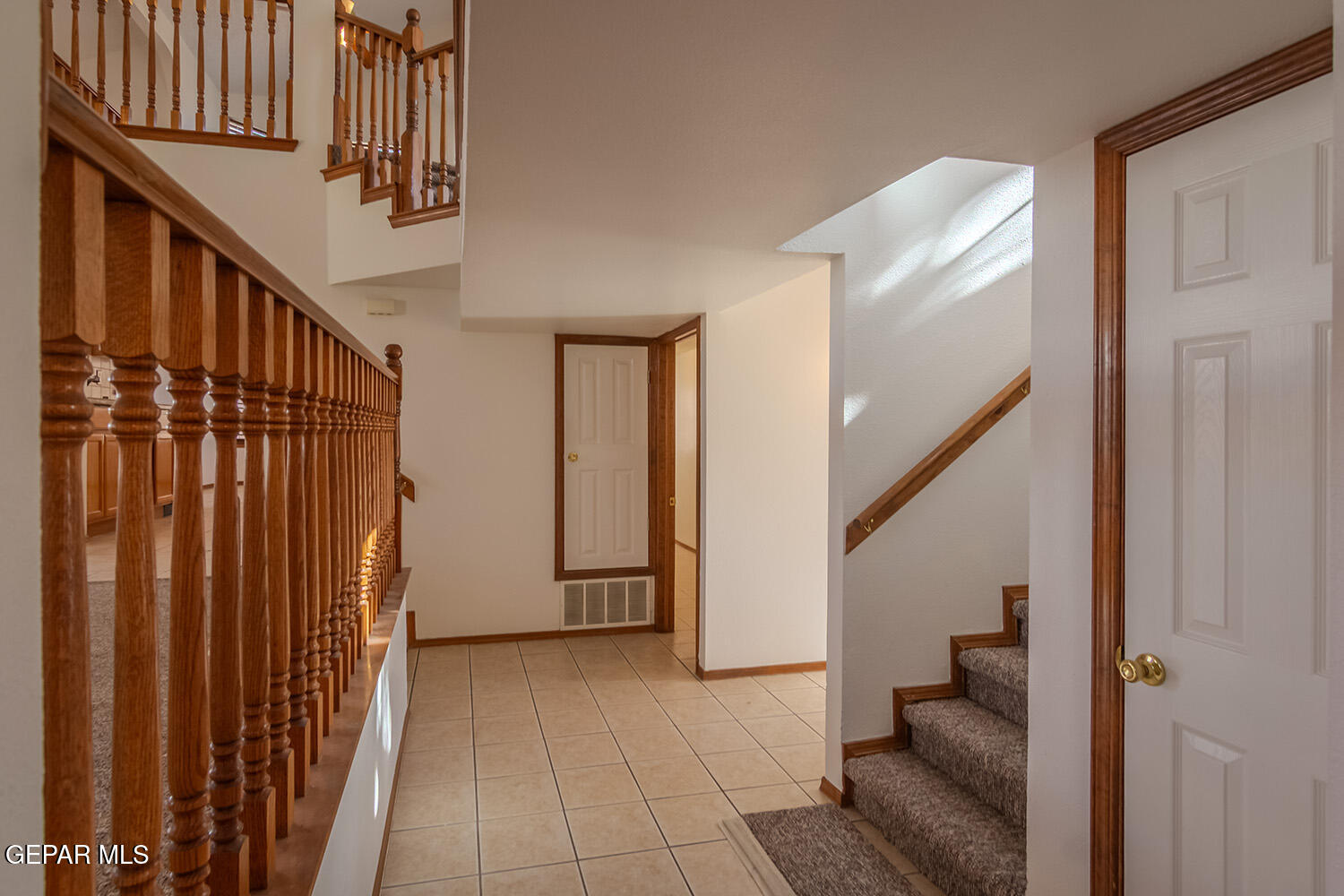 12259 Tierra Loma Road El Paso, TX 79938 - Photo 7 of 73 a view of staircase with lots of frames on wall and a window