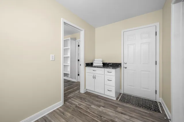 a room with a dresser and a mirror