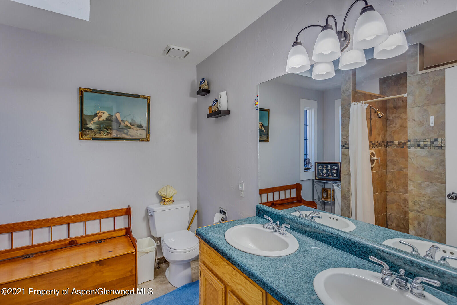 265 Badger Road El Jebel, CO 81623 - Photo 13 of 27 a bathroom with a granite countertop sink mirror and toilet