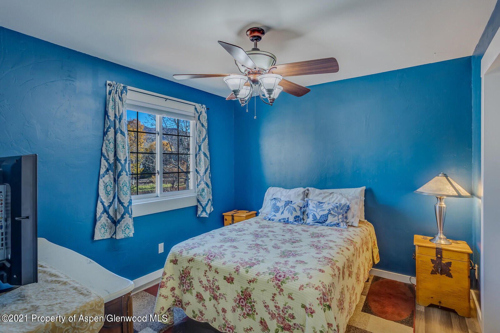 265 Badger Road El Jebel, CO 81623 - Photo 15 of 27 a bedroom with a bed dresser and a window