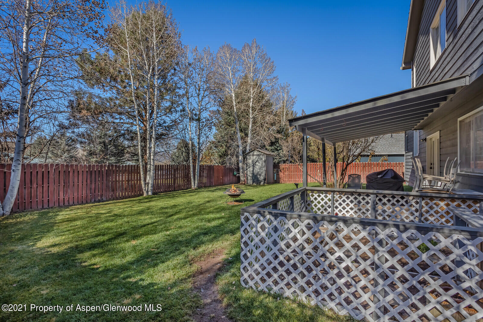 265 Badger Road El Jebel, CO 81623 - Photo 20 of 27 a view of a backyard with a garden and trees