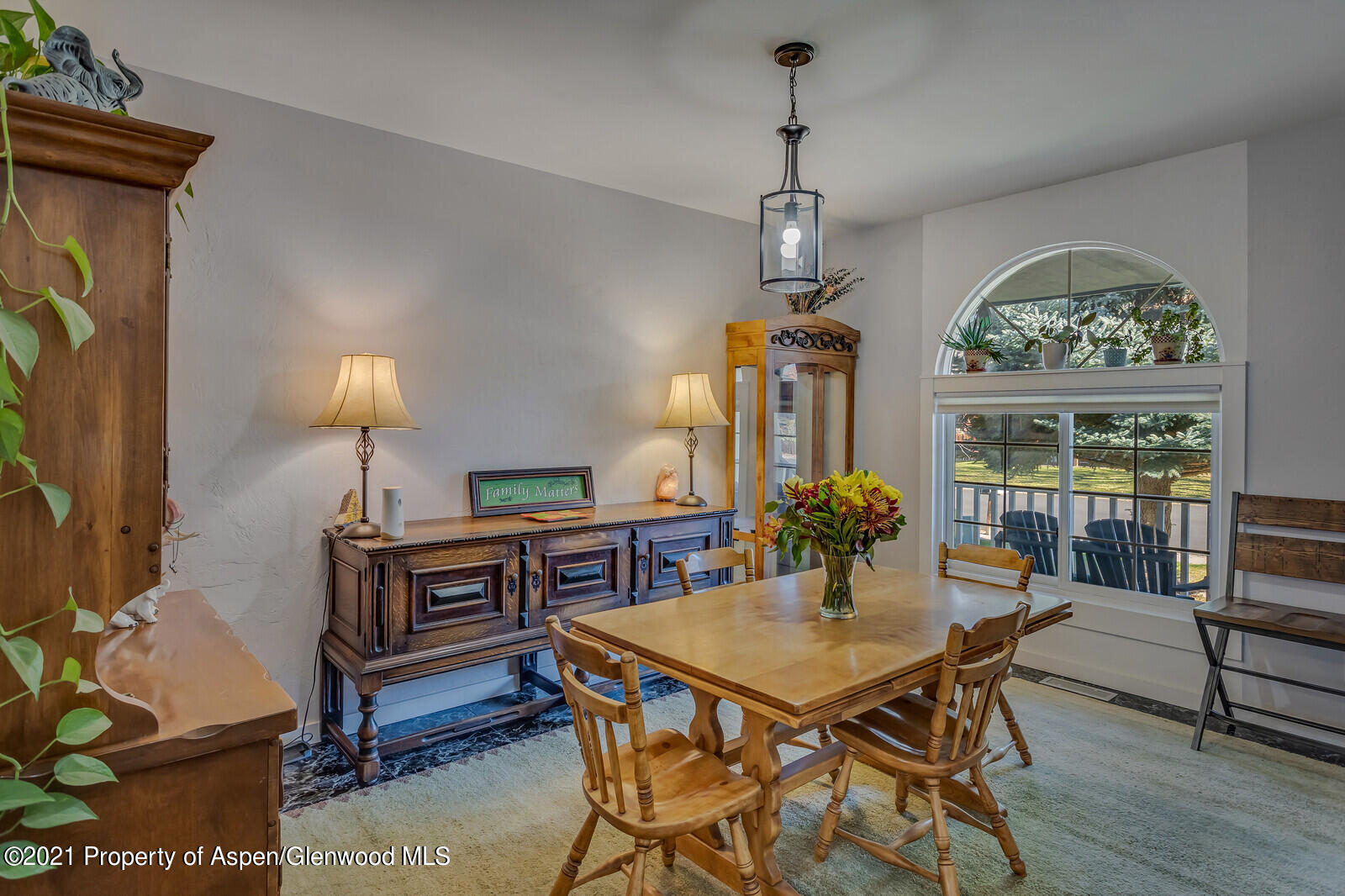 265 Badger Road El Jebel, CO 81623 - Photo 10 of 27 a view of a dining room with furniture window and wooden floor