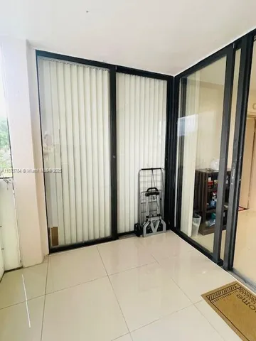 a view of a room with a large mirror