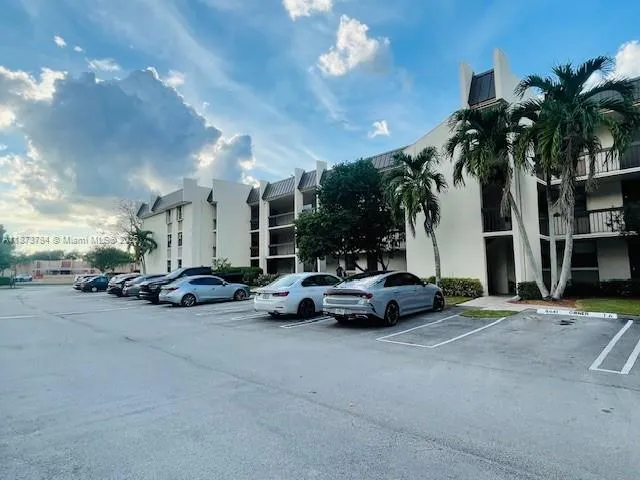 a view of street with parked cars