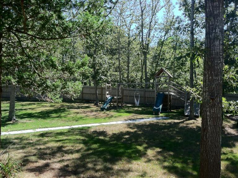 87 Chatham Road Harwich, MA 02645 - Photo 13 of 15 a view of a backyard with large trees