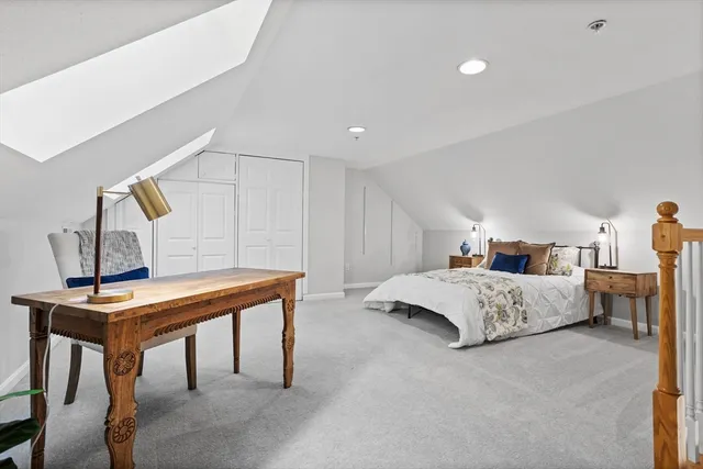 a bedroom with furniture and window