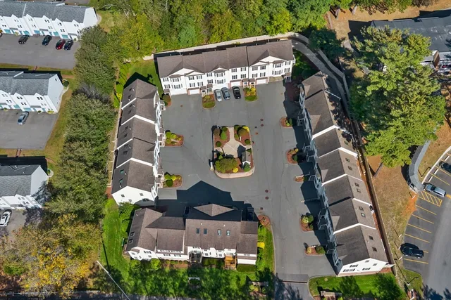 an aerial view of a house with a swimming pool