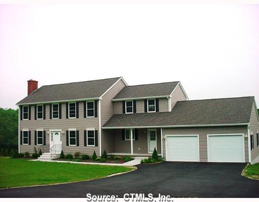 543 Quinns Hill Road Killingly, CT 06241 - Photo 1 of 1 a front view of a house with a garden and plants