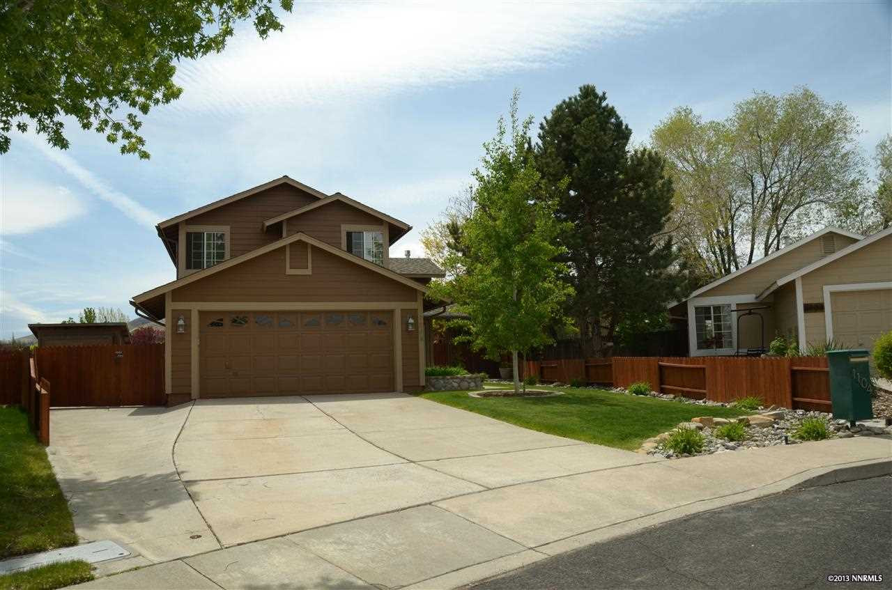 1104 Indian Cove Way Reno, NV 89523 - Photo 1 of 1 a front view of a house with a yard and garage