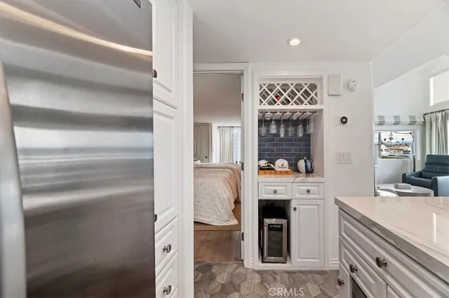 a room with white cabinets and white appliances
