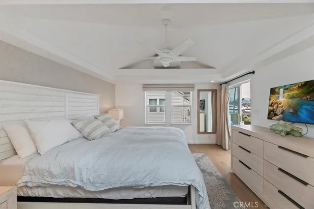 a bedroom with a large bed and a flat screen tv