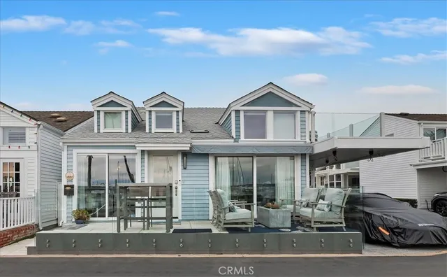 a front view of a house with a parking space