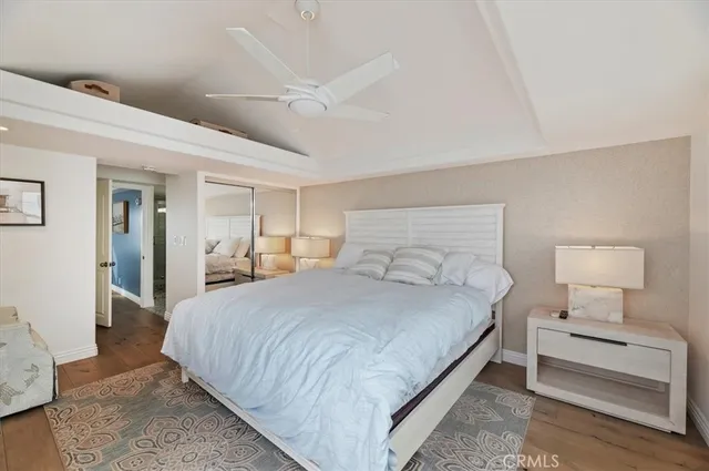 a bedroom with bed and a night stand