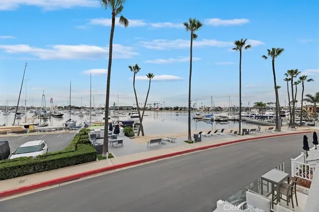 a view of a lake with boats next to a bridge