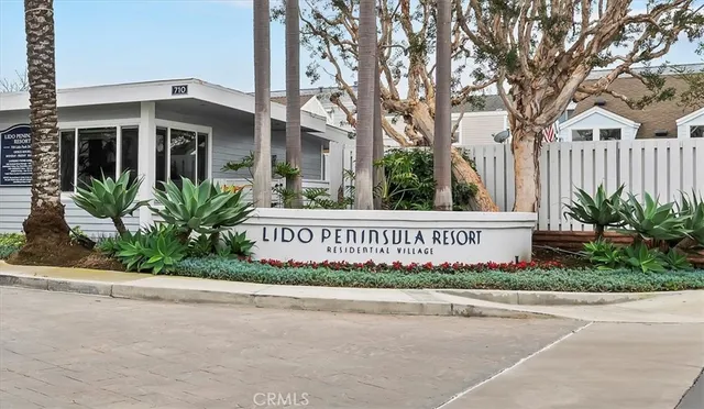 a building with palm trees in front of it