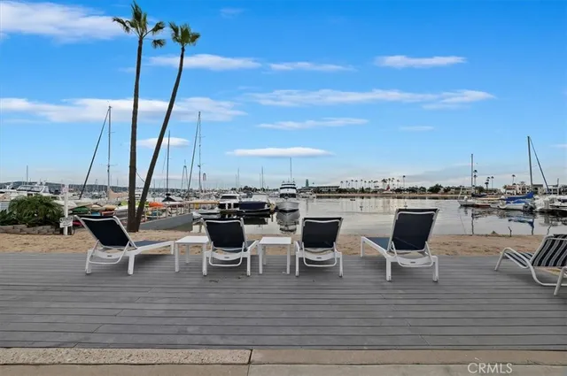 a view of water with boats and trees in the background