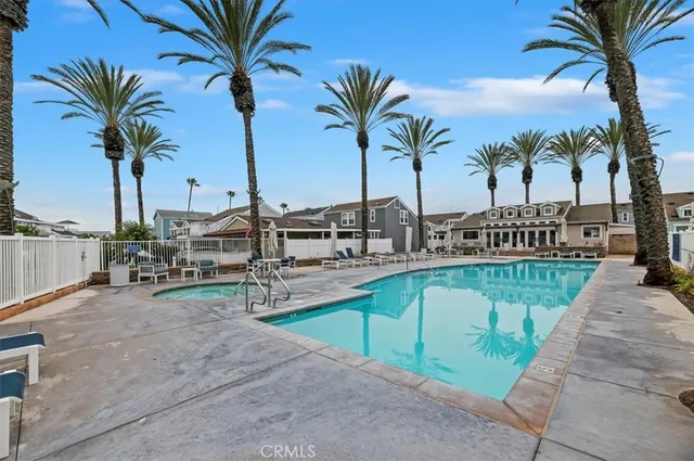 a view of a swimming pool with outdoor seating