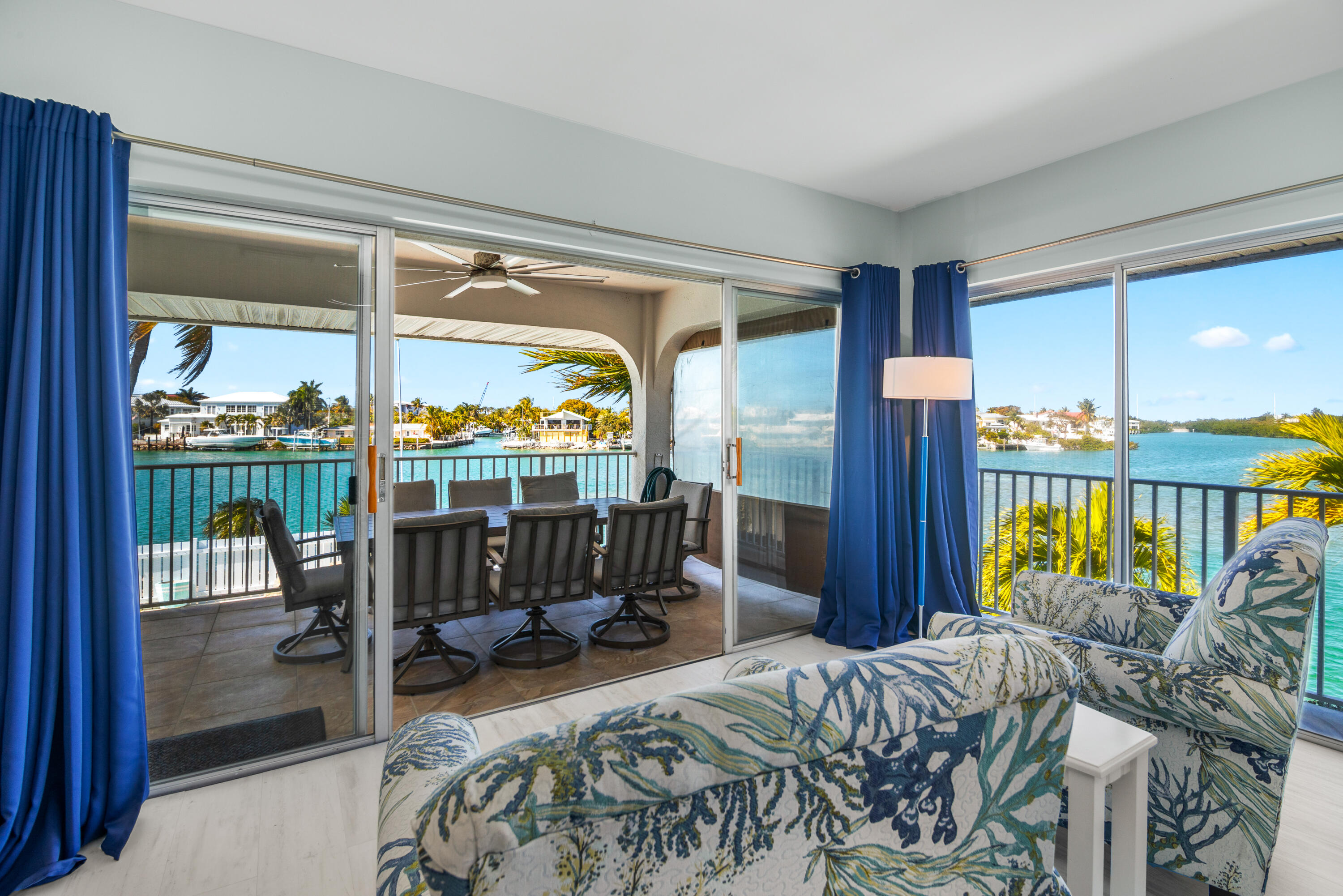 781 9th Street Key Colony Beach, FL 33051 - Photo 13 of 95 a bedroom with furniture and large windows