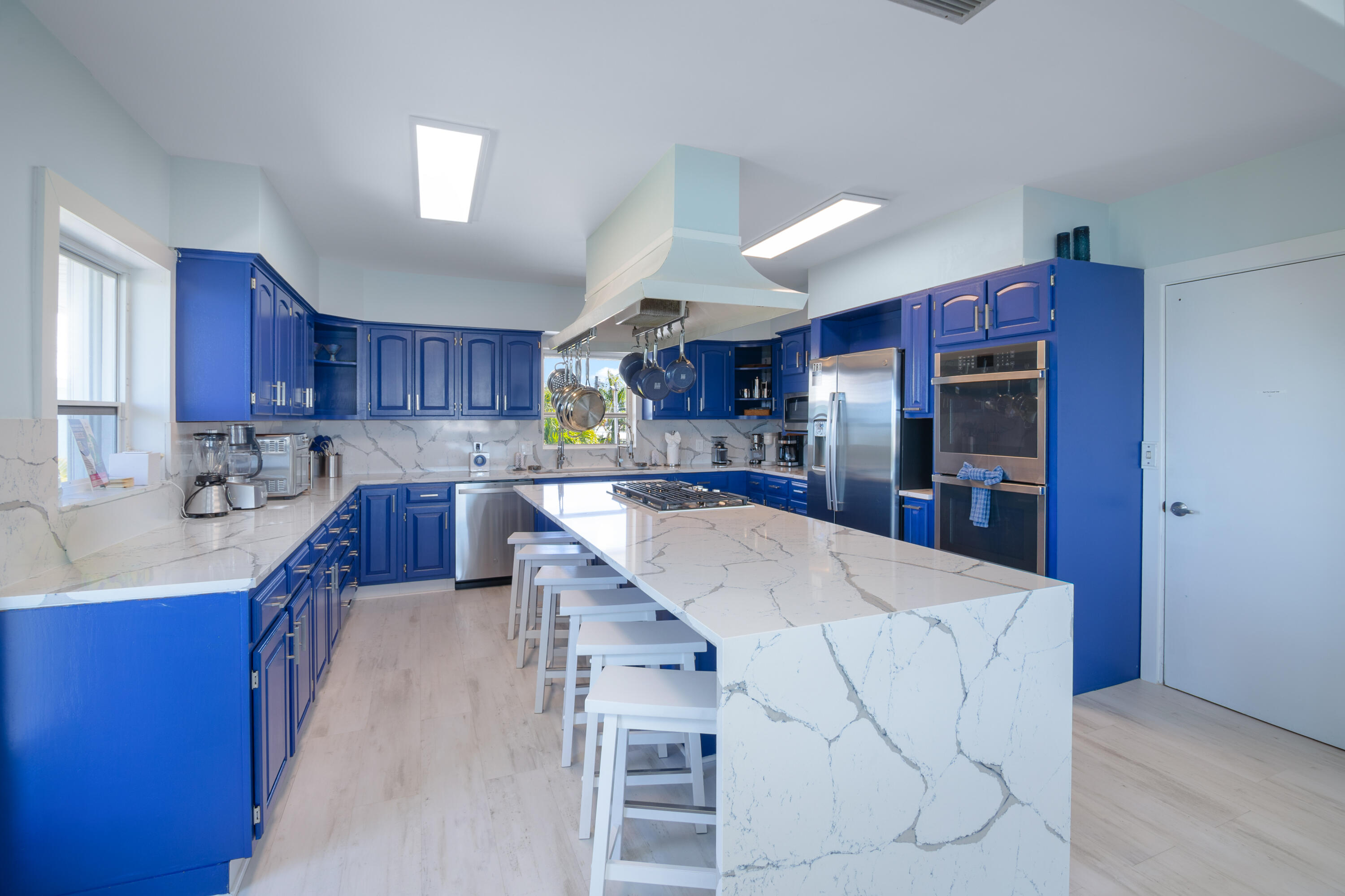 781 9th Street Key Colony Beach, FL 33051 - Photo 18 of 95 a large kitchen with cabinets and stainless steel appliances