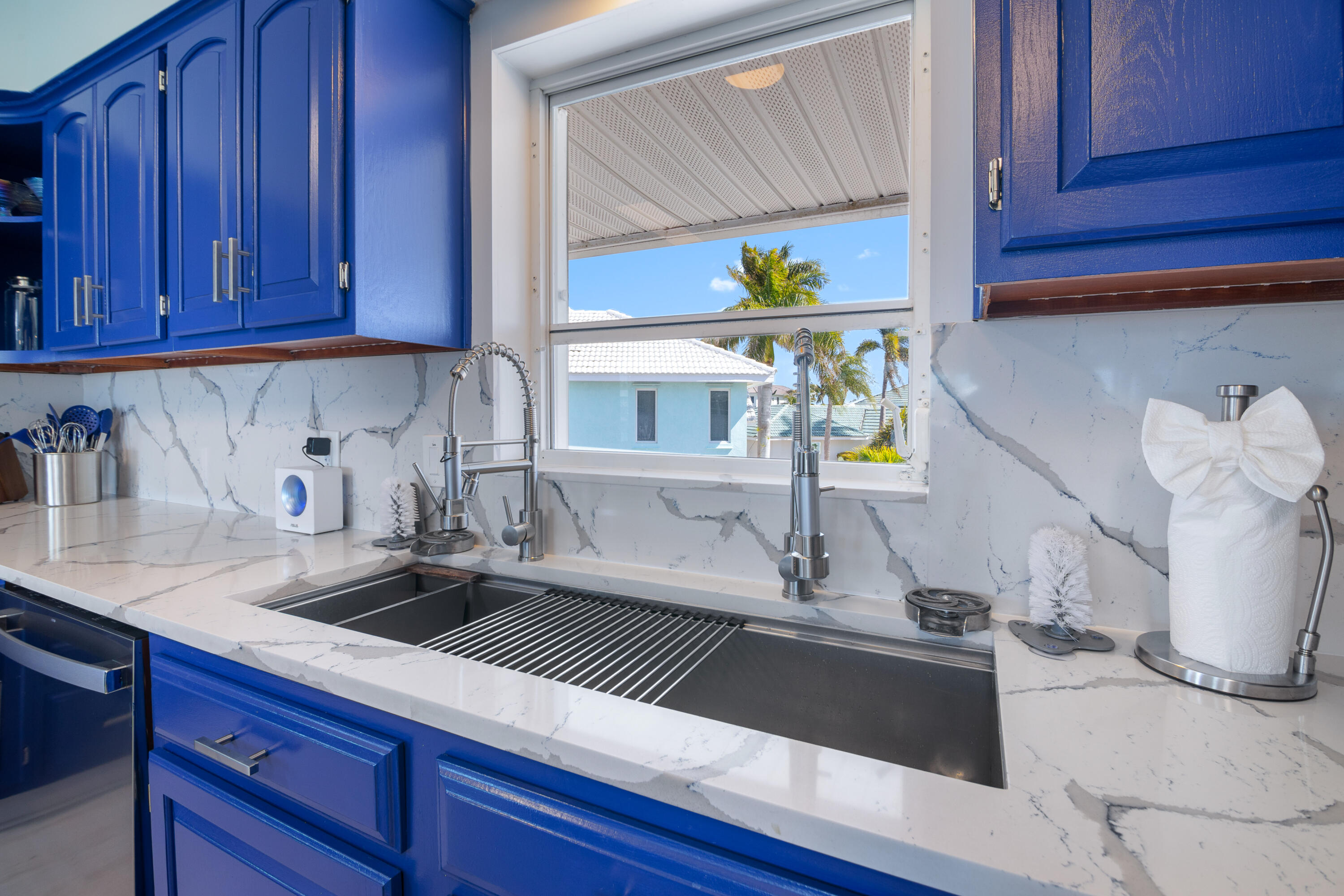 781 9th Street Key Colony Beach, FL 33051 - Photo 21 of 95 a kitchen with a sink and cabinets
