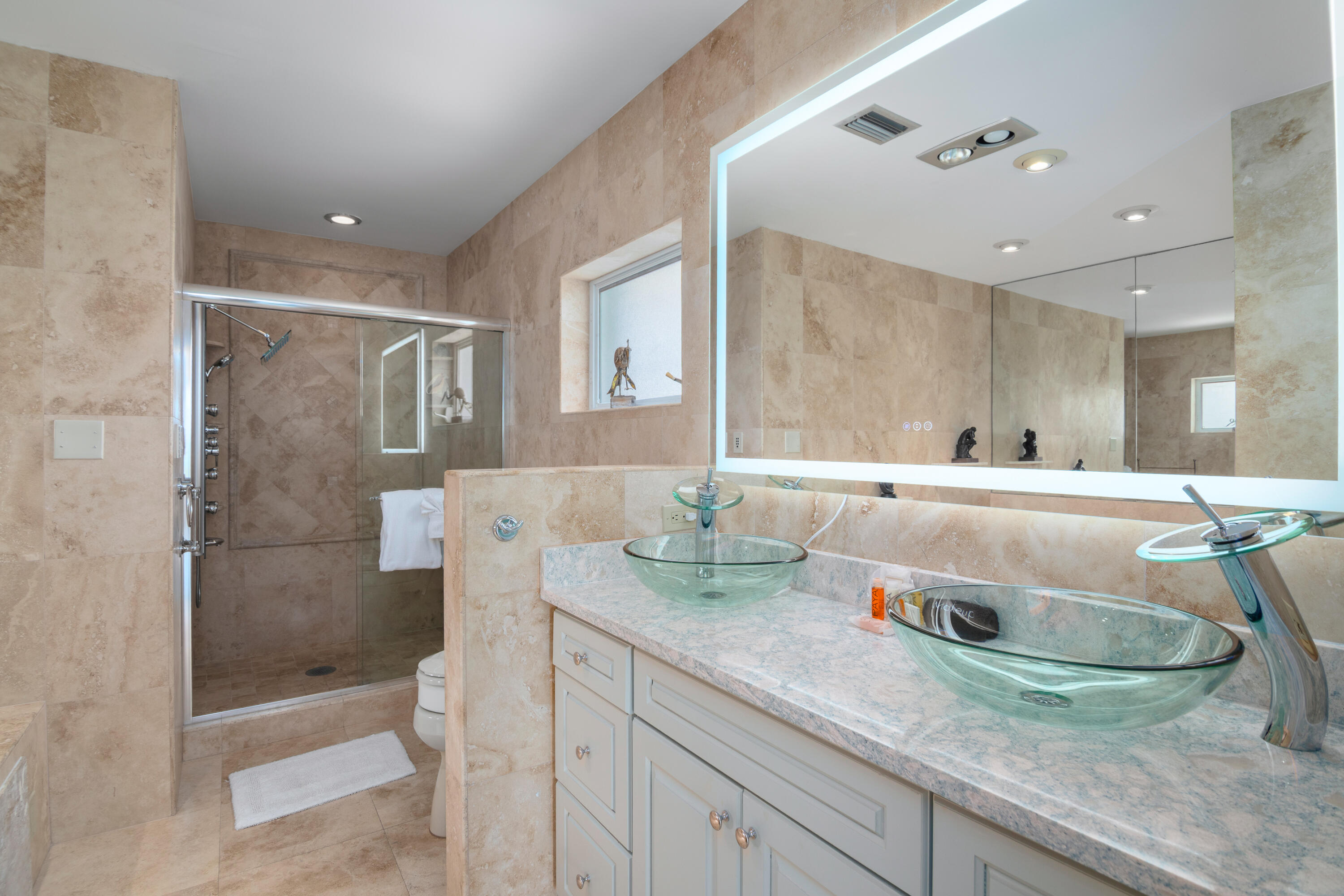 781 9th Street Key Colony Beach, FL 33051 - Photo 31 of 95 a bathroom with a granite countertop sink mirror and shower