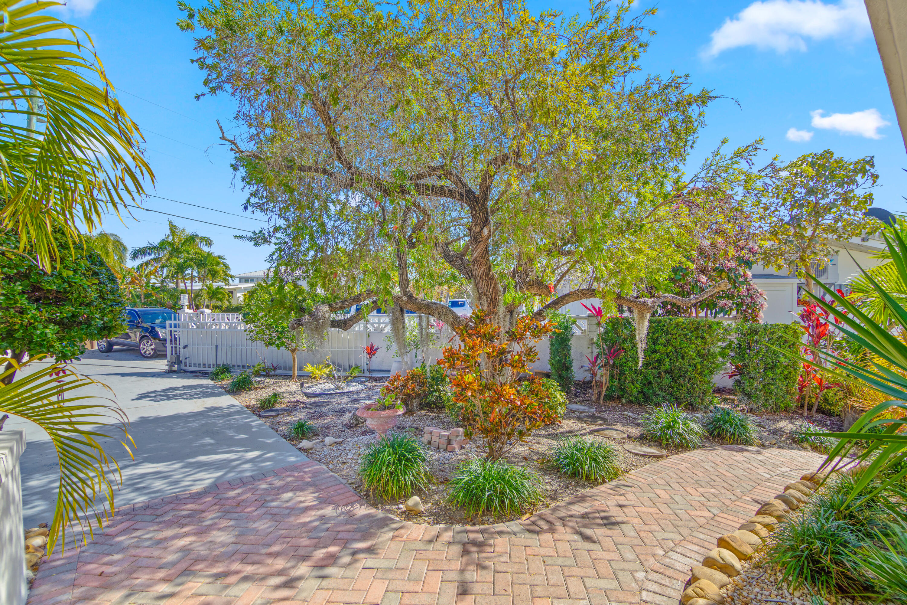 781 9th Street Key Colony Beach, FL 33051 - Photo 70 of 95 a backyard of a house with lots of green space