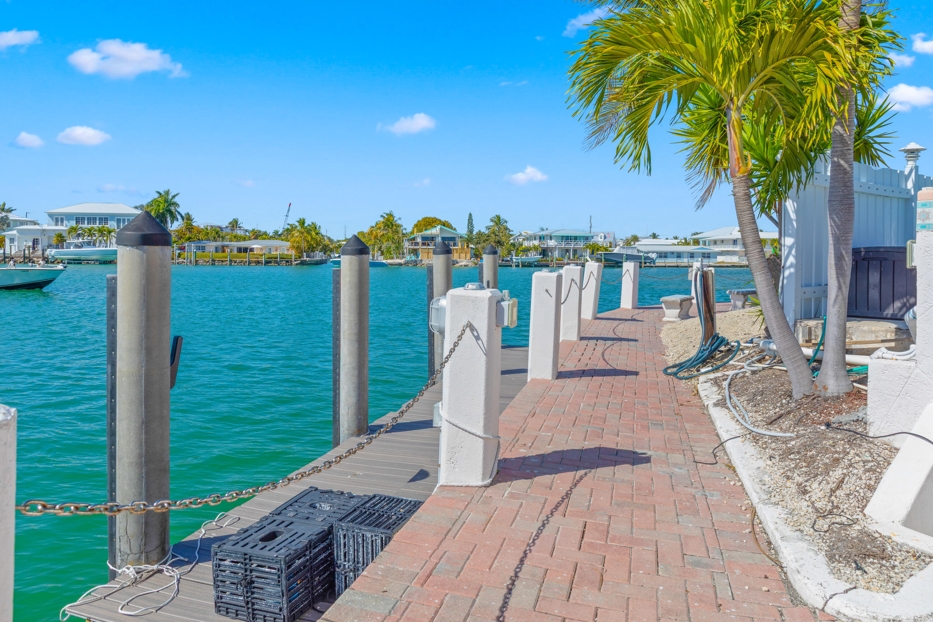781 9th Street Key Colony Beach, FL 33051 - Photo 71 of 95 a view of a swimming pool with a patio and a yard