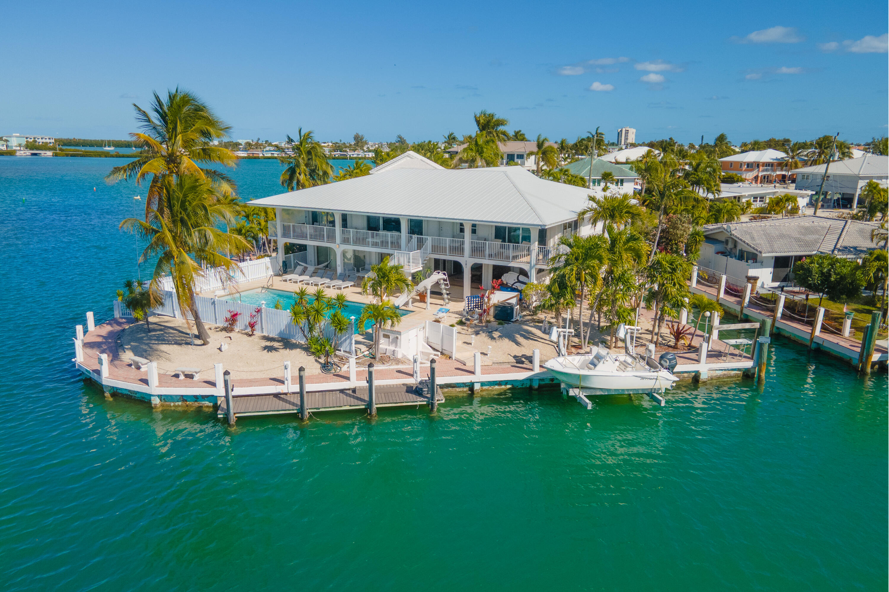 781 9th Street Key Colony Beach, FL 33051 - Photo 79 of 95 a view of a house with a backyard patio and swimming pool