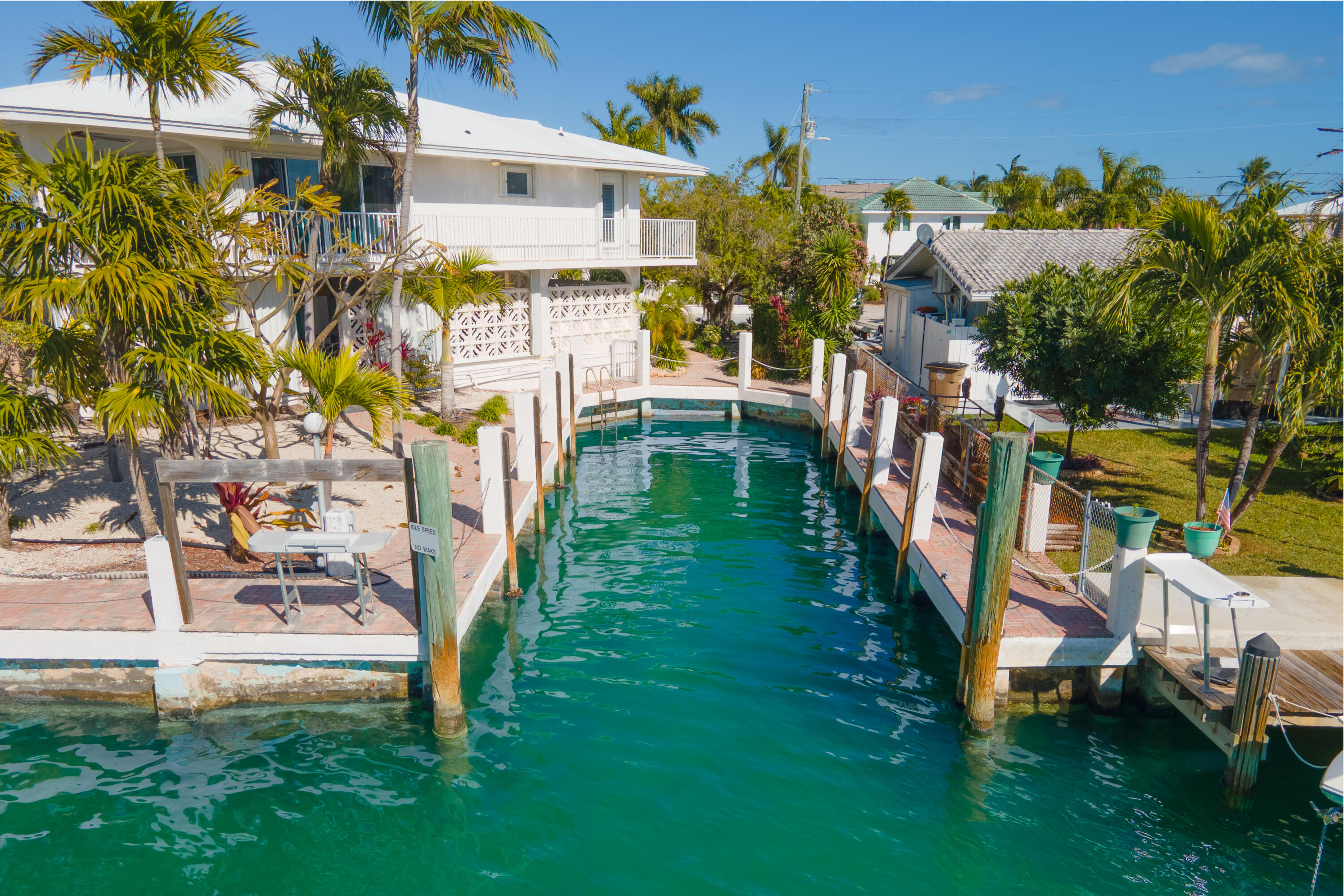 781 9th Street Key Colony Beach, FL 33051 - Photo 82 of 95 a view of an house with backyard space and garden