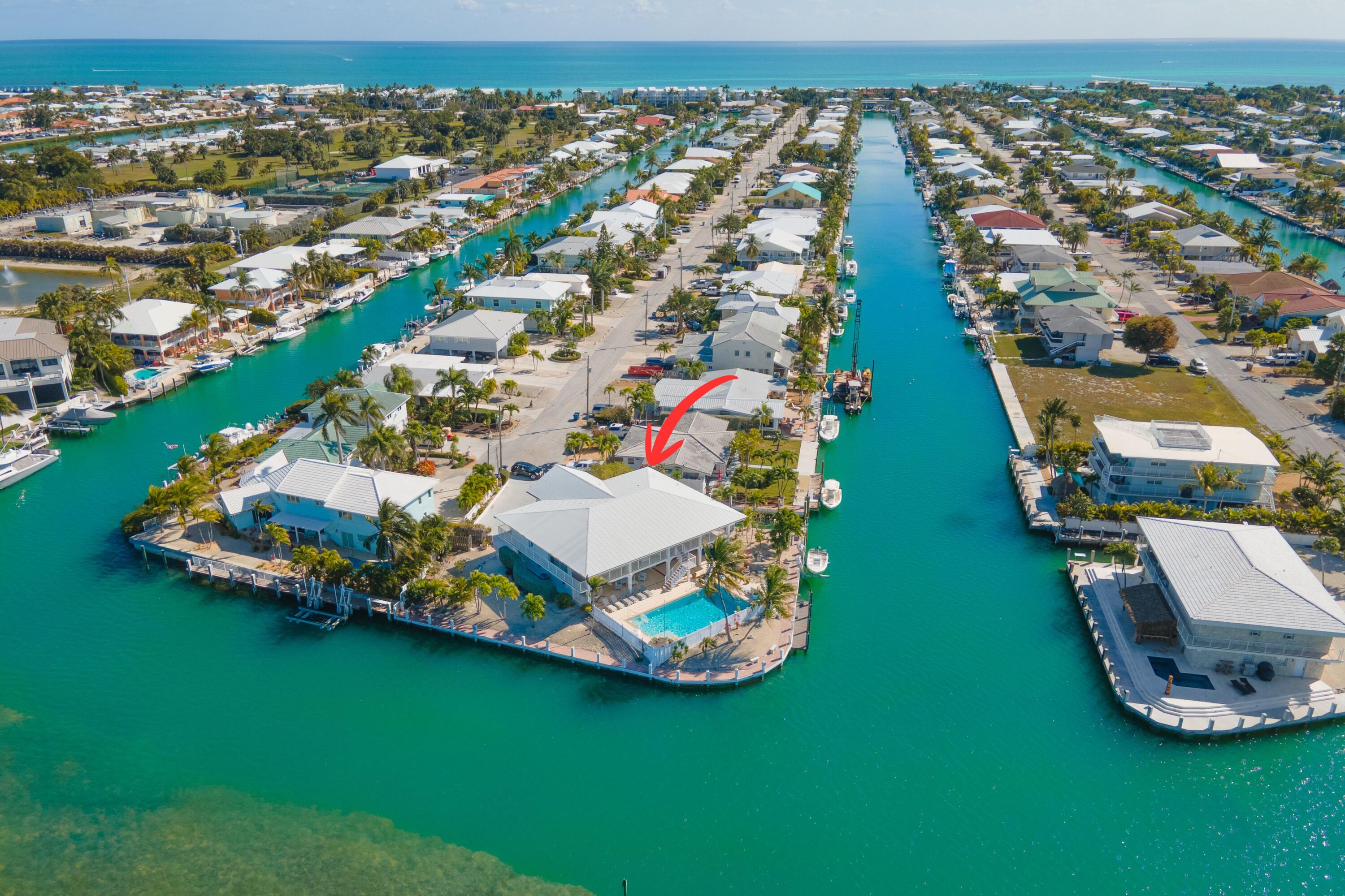 781 9th Street Key Colony Beach, FL 33051 - Photo 88 of 95 an aerial view of a house with a garden and lake view