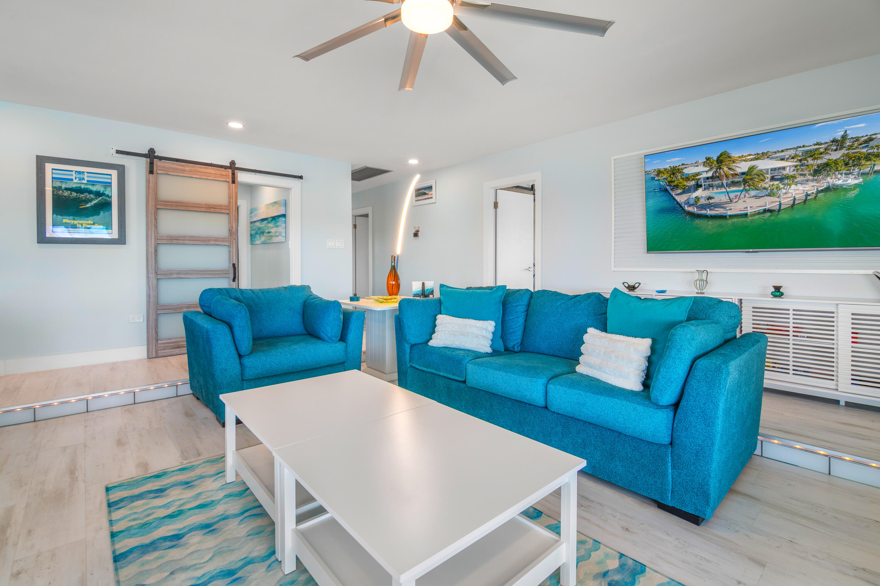 781 9th Street Key Colony Beach, FL 33051 - Photo 9 of 95 a living room with furniture and a flat screen tv