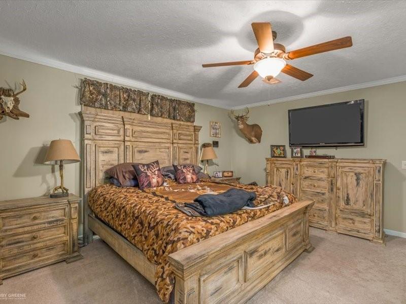 128 Gas Plant Road Doyline, LA 71023 - Photo 10 of 39 a bedroom with bed tv and couch