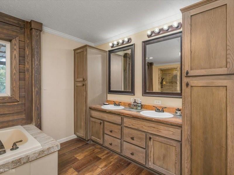 128 Gas Plant Road Doyline, LA 71023 - Photo 11 of 39 a bathroom with a double vanity sink and a mirror