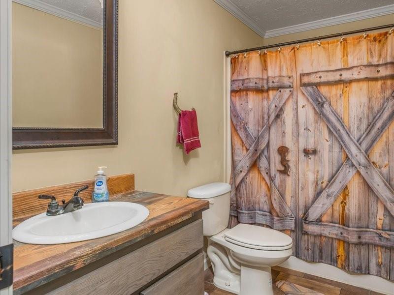 128 Gas Plant Road Doyline, LA 71023 - Photo 14 of 39 a bathroom with a sink toilet and a mirror