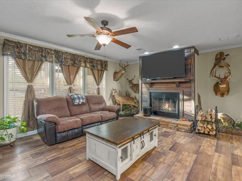 128 Gas Plant Road Doyline, LA 71023 - Photo 2 of 39 a living room with furniture and a fireplace