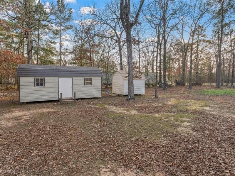 128 Gas Plant Road Doyline, LA 71023 - Photo 26 of 39 a view of a house with a back yard