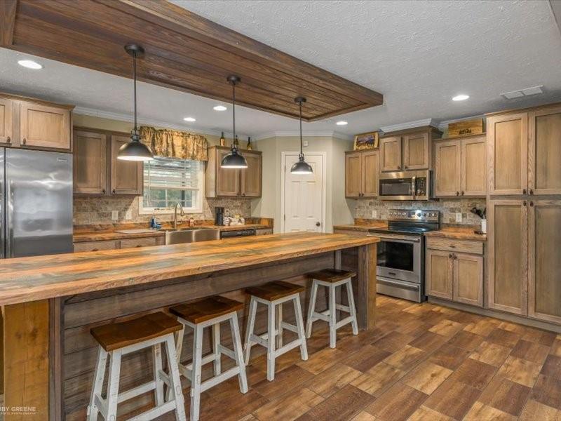 128 Gas Plant Road Doyline, LA 71023 - Photo 7 of 39 a kitchen with stainless steel appliances granite countertop a sink and cabinets