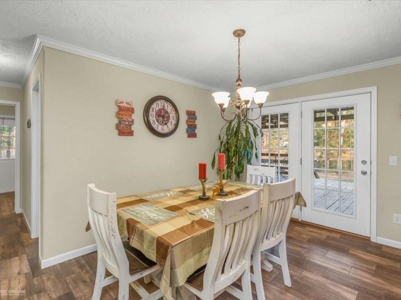 128 Gas Plant Road Doyline, LA 71023 - Photo 8 of 39 a dining room with a wooden table and chairs