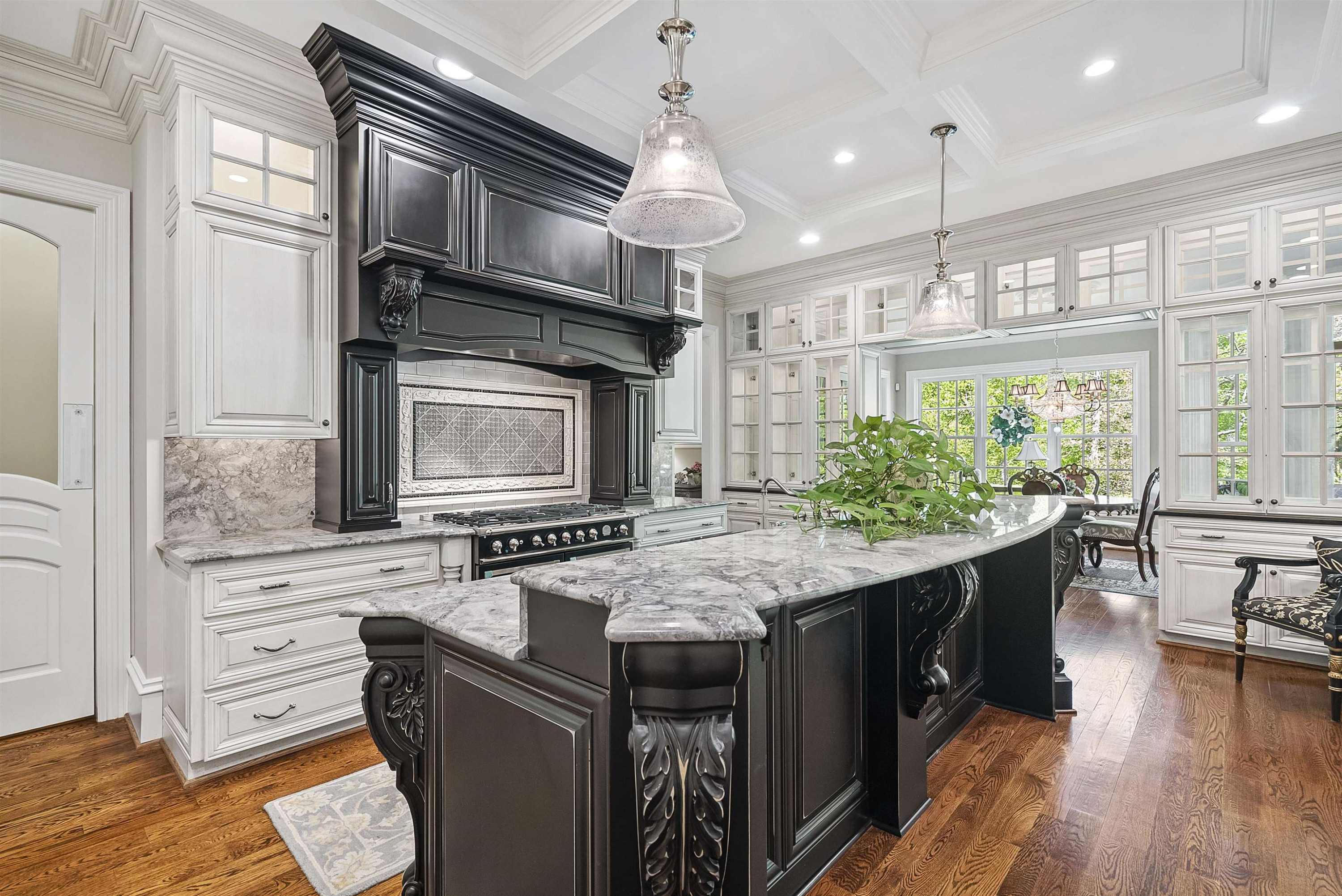 11212 Conley Cove Court Raleigh, NC 27613 - Photo 21 of 89 Top of the line appliances & notice the wall of lighted cabinets to display your crystal! Kitchen