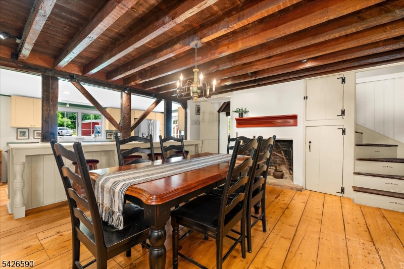 179 Lindbergh Road Hopewell, NJ 08525 - Photo 15 of 46 a dining room with furniture and a floor to ceiling window