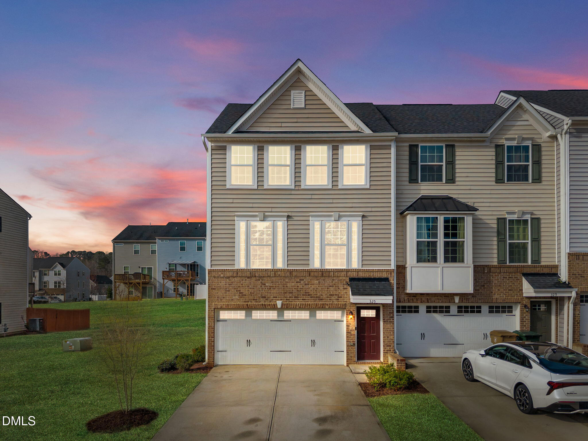 a front view of a house with a yard