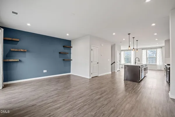 a kitchen with stainless steel appliances granite countertop a sink and a microwave