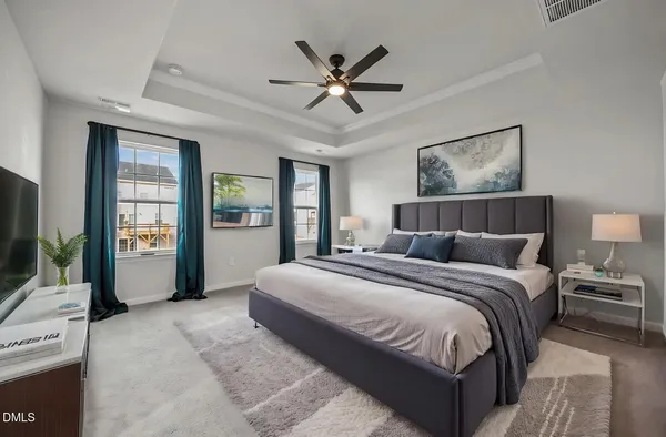 a view of a kitchen with a sink wooden cabinets and a window