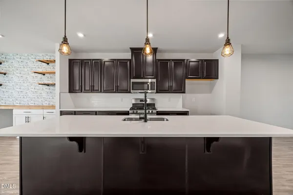 a front view of a residential apartment building with a yard