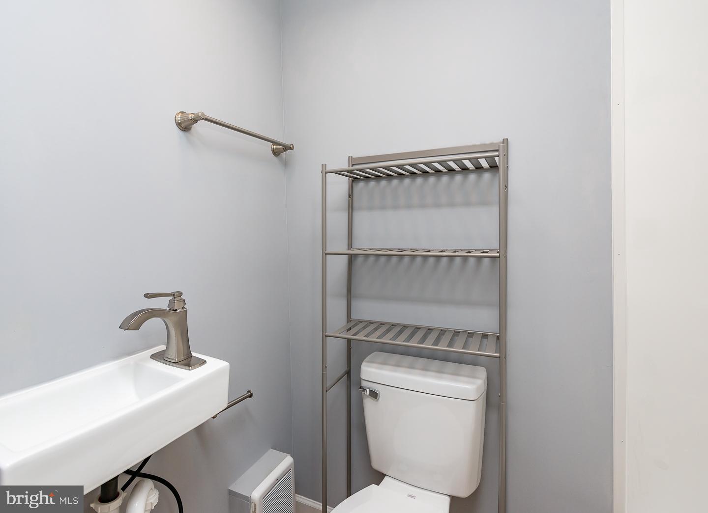 2735 Waterloo Street Philadelphia, PA 19133 - Photo 25 of 25 a bathroom with a toilet and a sink