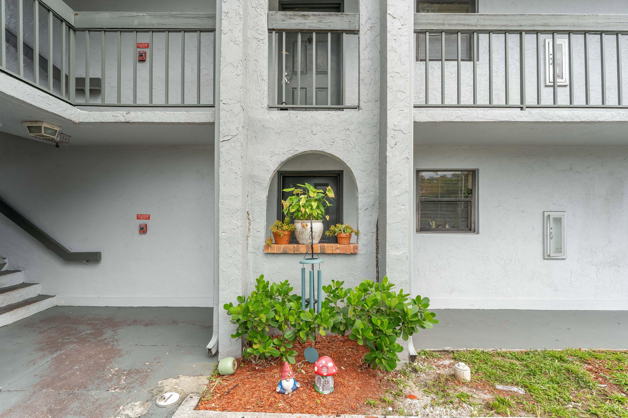 a view of entryway with flower pots