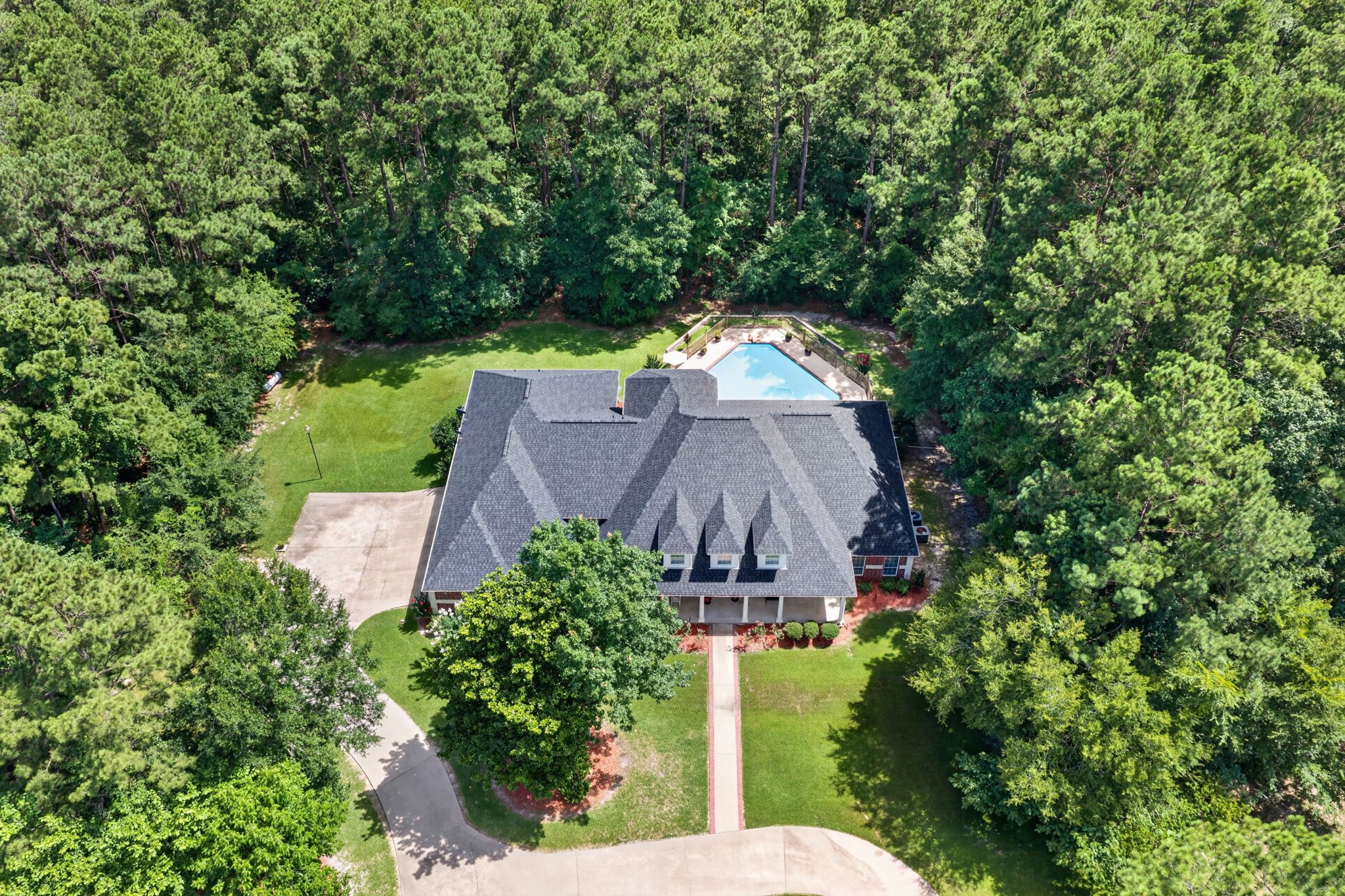 341 Billy Clark Road Huntington, TX 75949 - Photo 5 of 40 an aerial view of a house with a yard and trees all around