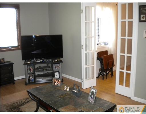 123 Redpine Loop Old Bridge, NJ 08857 - Photo 15 of 24 a living room with furniture and a flat screen tv