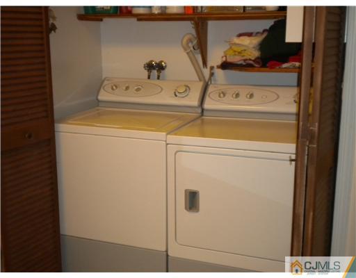 123 Redpine Loop Old Bridge, NJ 08857 - Photo 19 of 24 a utility room with dryer and washer